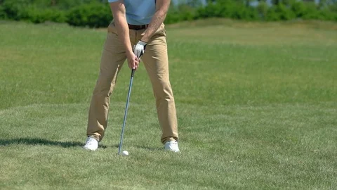 Upset golf player hitting ball and missing, bad position for hit, slow-motion Stock Footage 114328146