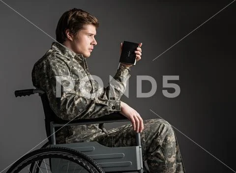 Upset handicapped veteran thinking about past Stock Photos
