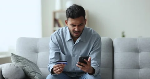 Upset Indian man have problem with online payment Stock Footage 239859270