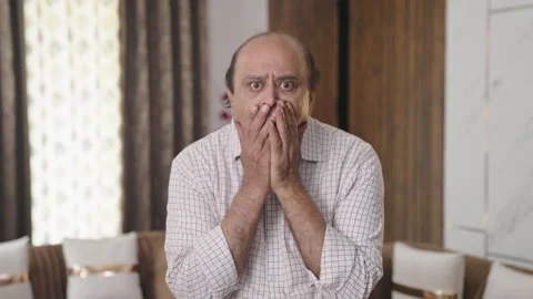 Upset Indian old man getting a shocking | Stock Video | Pond5