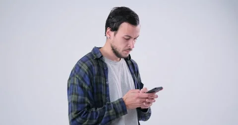 Upset Man chatting using phone Video stock 143943128