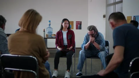 Upset man crying during group psychotherapy session Stock Footage 157072571