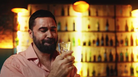 Upset man drinking liquor at bar, struggling with financial problems and stress Stock Footage 312752831
