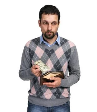 Upset man holding one dollar in hand and showing empty wallet to Stock Photos