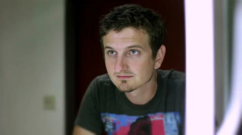 Upset man looking at himself in mirror Stock Footage 31248926