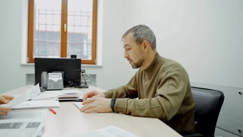 Upset Man at the negotiation table talking to an employee. Stock Footage 140796564