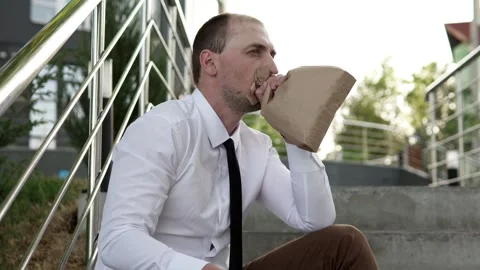 Man Breathing Into Paper Bag