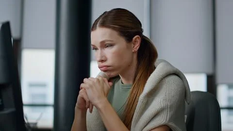 Upset manager solving problem in office. Focused woman developer analyzing code 写真素材