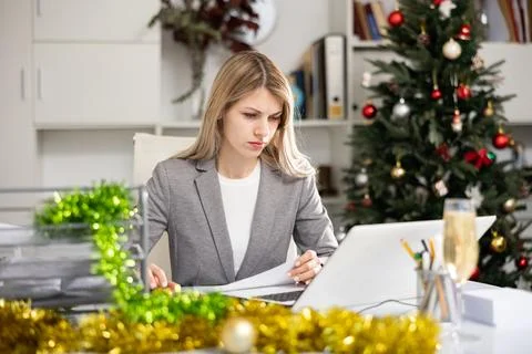 Upset manager working at computer during christmas holidays Stock Photos
