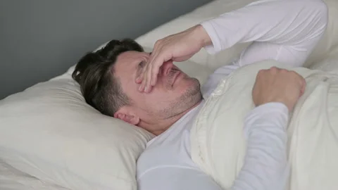 Upset Middle Aged Man Crying in Bed Stock Footage 142375655