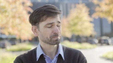 Upset Office Worker Standing Outside, Surrounded by Fall Colors Stock Footage 293680058