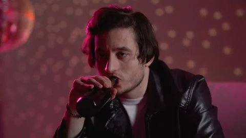 Upset pensive man drinking beer at nightclub disco party, thinking about problem Stock Footage 105137707