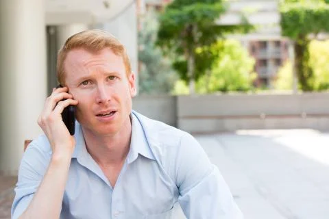 Upset with phone call Stock Photos