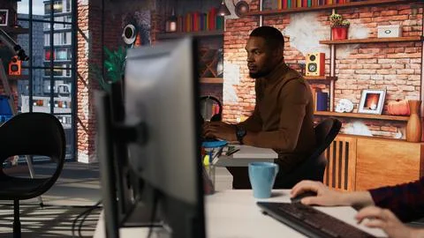 Upset programmer annoyed by computer bugs while coding in IT startup office 写真素材