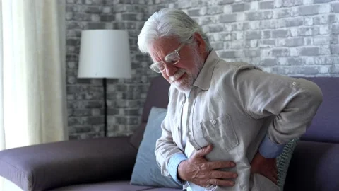 Upset senior elder man feel sudden back pain muscles ache tension injury si.. Stock Footage 231624963