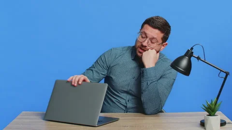 Upset tired man sitting at table using laptop having anxiety stress closing Stock Footage 327988622