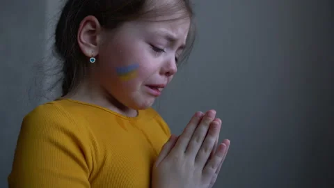 Upset Ukrainian girl crying protesting war conflict. Child against Russian war Stock Footage 172200540