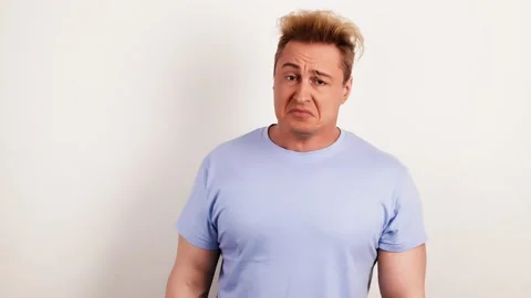 Upset unhappy man looking at camera. Frustrated sad handsome guy, depression Stock Footage 234532560