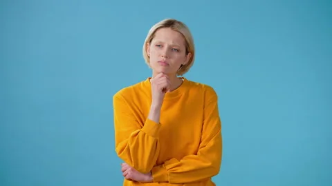 Upset woman considers solution to problem massaging chin Stock Footage 242601406