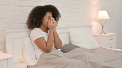 Upset Young African Woman Crying in Bed Stock Footage