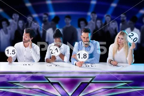 Upset Young Judges Giving Low Scores Stock Photos