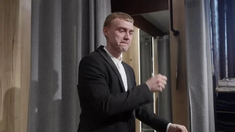 Upset Young Man Crying in a Fitting Room 스톡 동영상 330514843