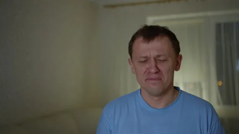 Upset young man refuses a stretched napkin Stock Footage 131431225