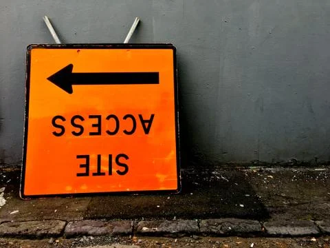 Upside down access site sign with arrow Stock Photos