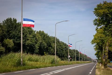Upside-down Dutch flags hang on houses and lampposts all over the country, Stock Photos