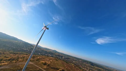 Upside down FPV flight views of modern ecological wind station. Huge white Stock Footage 189414060