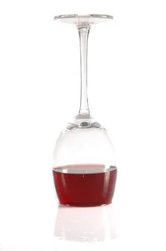 Upside-down  glass of  wine Stock Photos