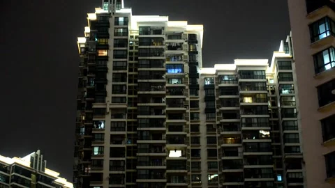 Upside-down shot of the high-rise residential buildings in the city at night Stock Footage 183738867
