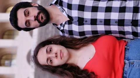 Upside down shot of young embraced couple smilling at camera Stock Footage 136552400