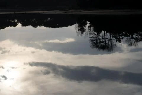 Upside Down Sky and Trees Reflection on Lake Port d’Albret Stock Photos