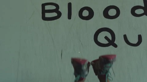 Upside down squats for strength training against a wall Stock Footage 312746760