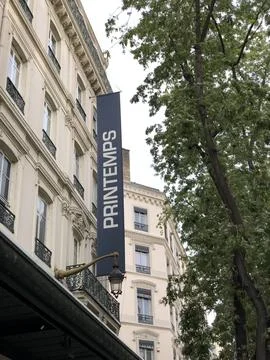 Upside-down view of Haussmann building with tree branches above, urban scene Stock Photos