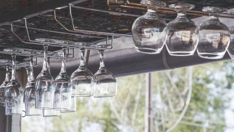 Upside Down Wine Glasses over the bar Stock Photos