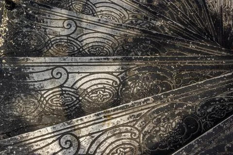Upside view of a spiral staircase pattern. Spiral stairs circle in old cozy c Stock Photos