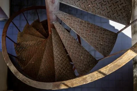 Upside view of a spiral staircase pattern. Spiral stairs circle in old courty Stock Photos