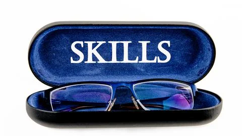 Upskilling and personal development concept. SKILLS words on the glasses case Stock Photos