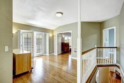 Upstairs room with walkout deck in empty house Stock Photos