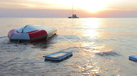 Upturned boat at the shore Stock Footage 64211327
