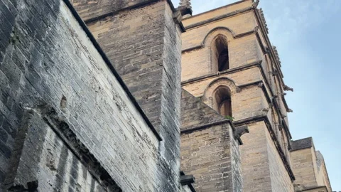 Upward Angle of Montpellier Cathedral Stone Tower Exterior Against Clear Blue Video stock 339066230