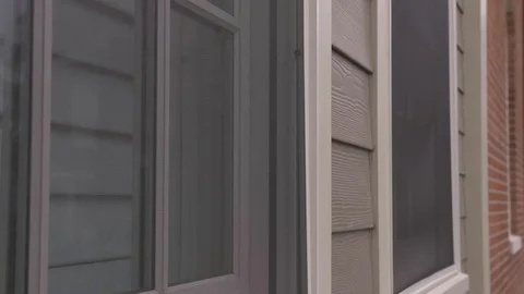 Upward Camera Movement of Exterior Window Screen Stock Footage 100899736