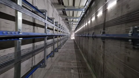 Upward Camera Ride Inside Industrial Elevator Shaft Vídeos de archivo 311568603
