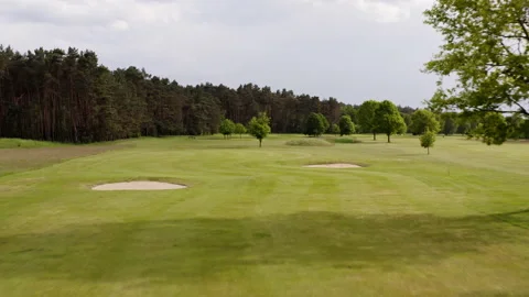 Upward drone flight over a golf course in Germany. The flight starts just above Stock Footage 163059346