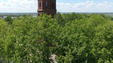 Upward drone flight revealing tower and landscape 動画素材 333484606
