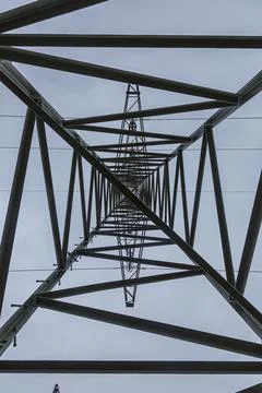 Upward looking image inside a power pole with structure of the steel frame Stock-Fotos