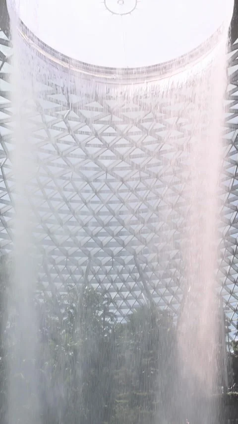 Upward Pan of Indoor Waterfall Beneath Glass Dome Video stock 314306700