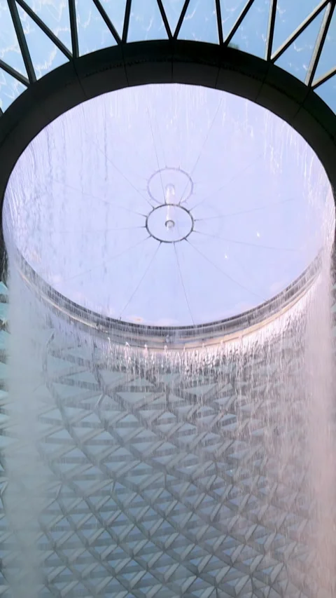 Upward Pan of Indoor Waterfall Under Glass Dome Video stock 314413486